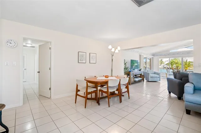 a bathroom with a sink vanity granite tub shower and a mirror