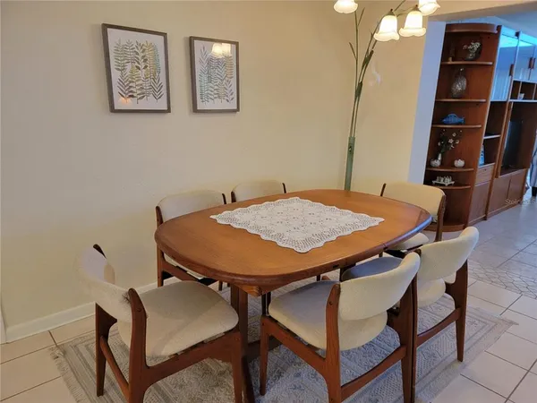 a bathroom with double vanity sinks and a large mirror