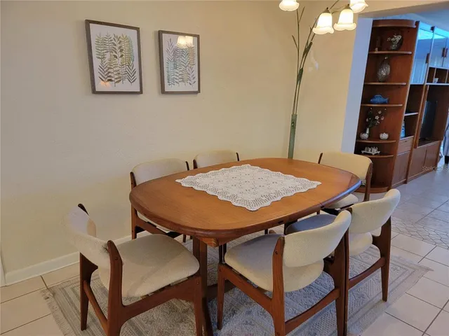 a bathroom with double vanity sinks and a large mirror
