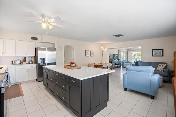 a bedroom with two beds and a window