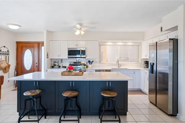 a view of swimming pool with a table and chairs