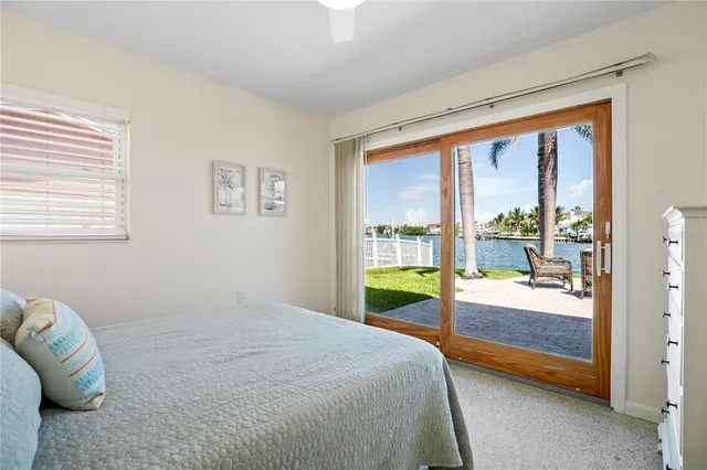 a street sign that is sitting on a brick wall