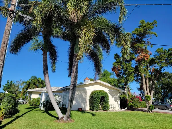 a view of a street with an outdoor seating