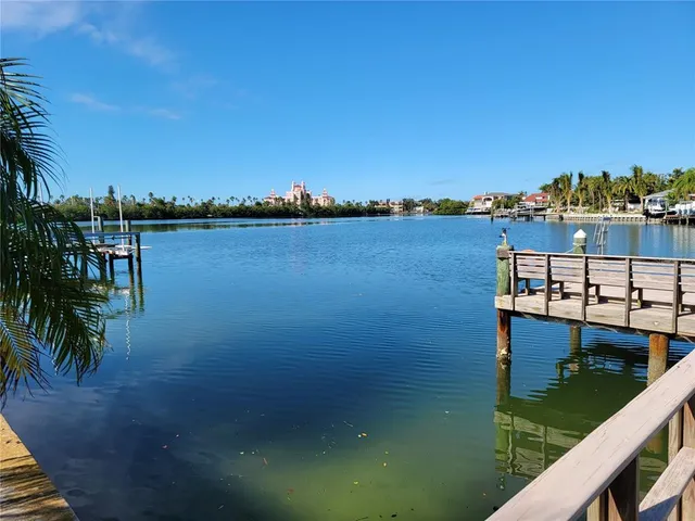 a view of swimming pool outdoor seating and lake view