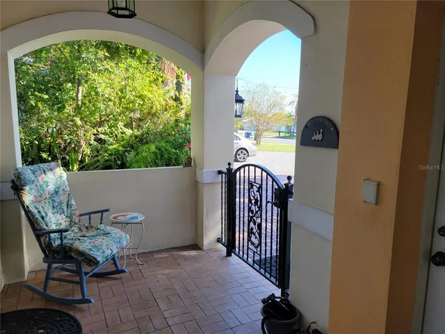 a view of a house with outdoor space and sitting area