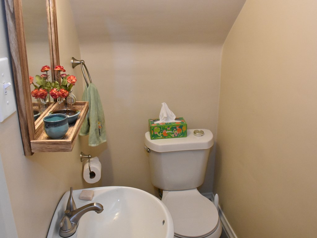 655 Chestnut Street Meadville, PA 16335 - Photo 17 of 43 a white toilet sitting next to a bathroom sink
