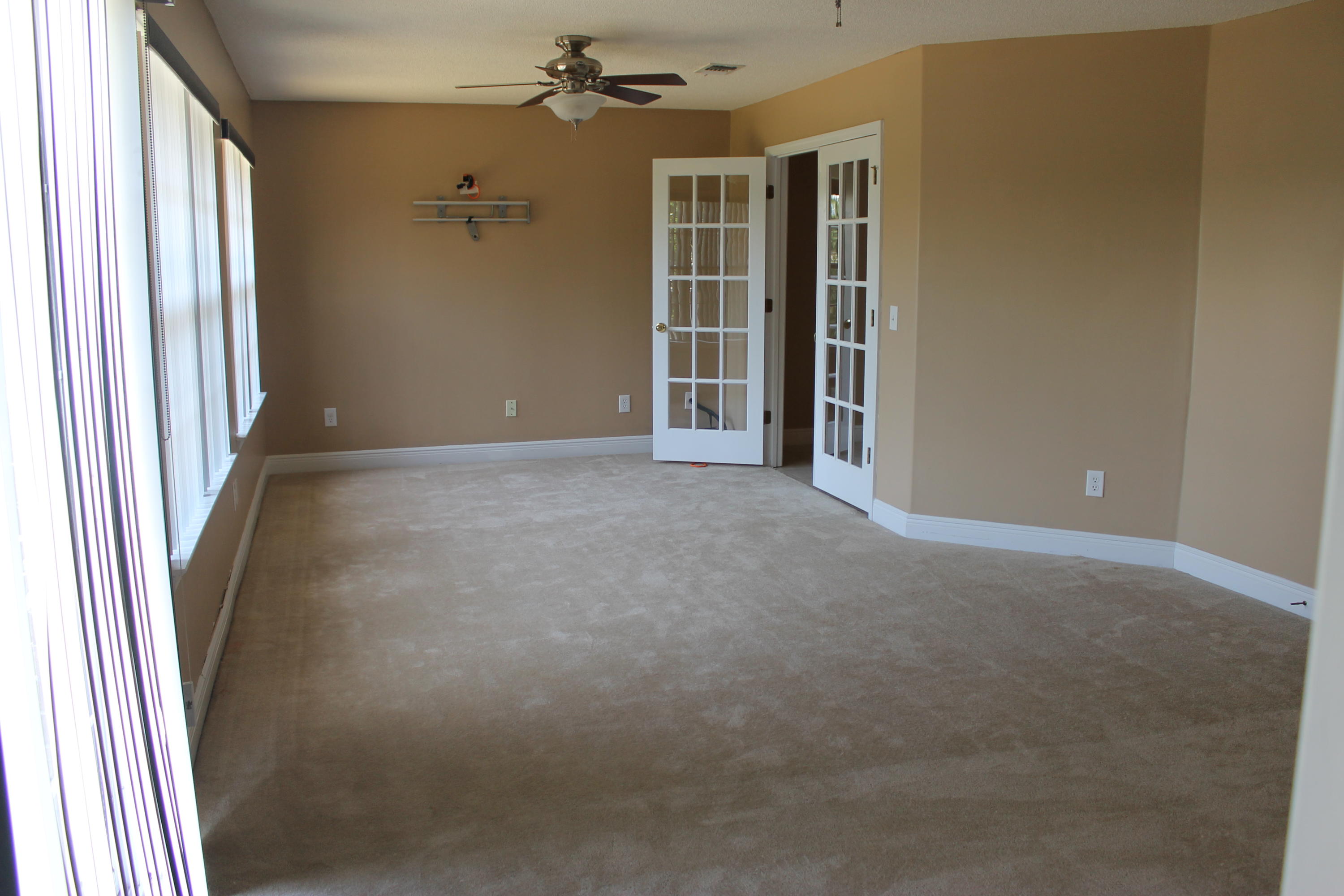 213 Foxchase Way Crestview, FL 32536 - Photo 11 of 34 an empty room with windows and closet