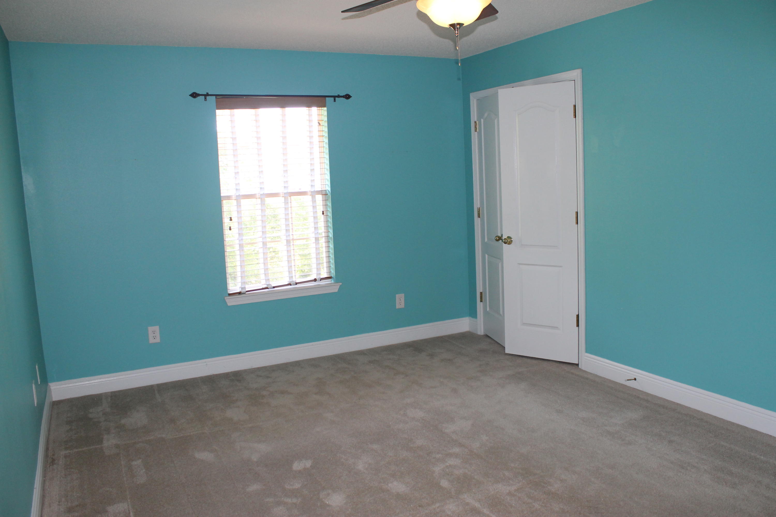213 Foxchase Way Crestview, FL 32536 - Photo 16 of 34 an empty room with a window and a ceiling fan