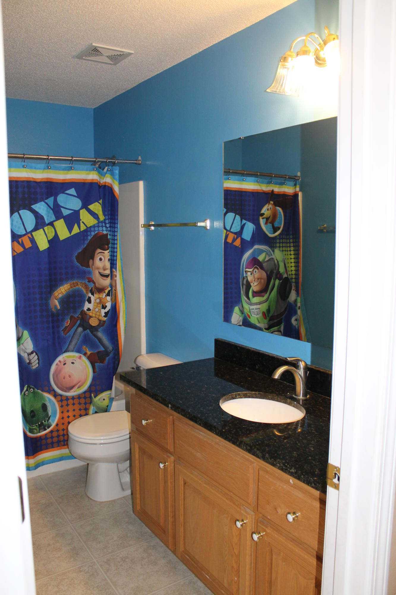 213 Foxchase Way Crestview, FL 32536 - Photo 18 of 34 a bathroom with a sink a toilet and painting on the wall