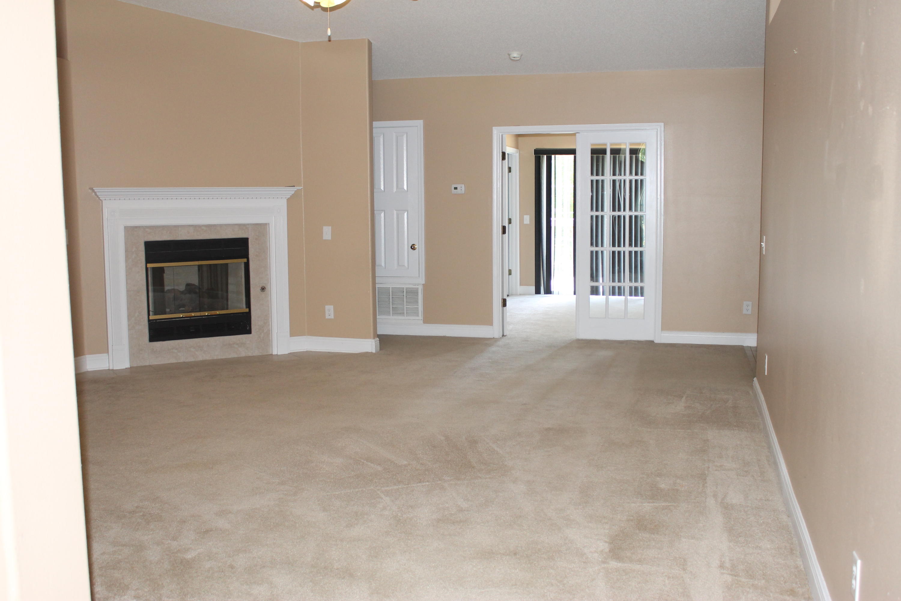 213 Foxchase Way Crestview, FL 32536 - Photo 3 of 34 an empty room with windows and fireplace
