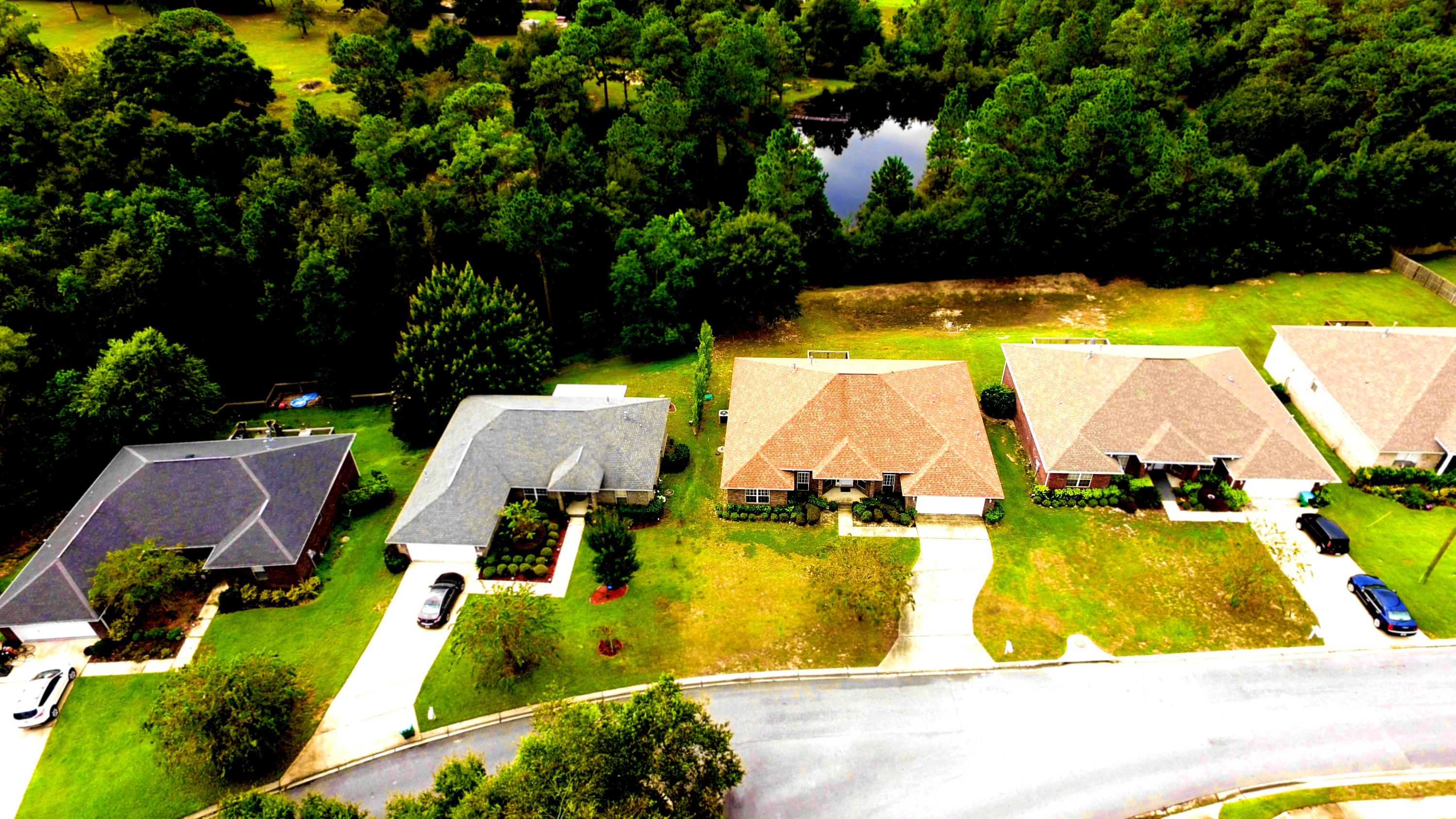213 Foxchase Way Crestview, FL 32536 - Photo 31 of 34 an aerial view of residential houses with outdoor space and swimming pool