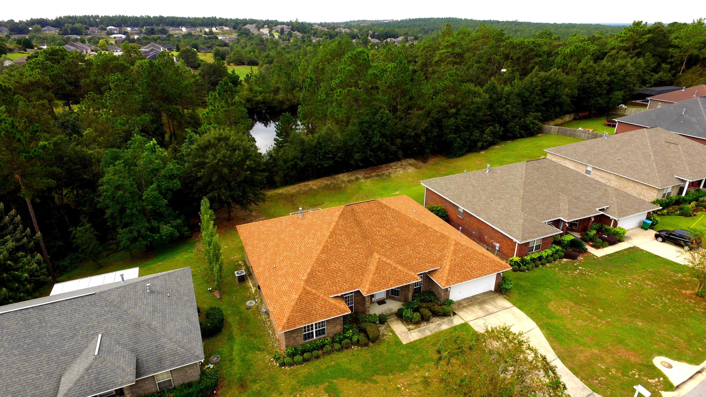 213 Foxchase Way Crestview, FL 32536 - Photo 33 of 34 an aerial view of a house with a garden and swimming pool