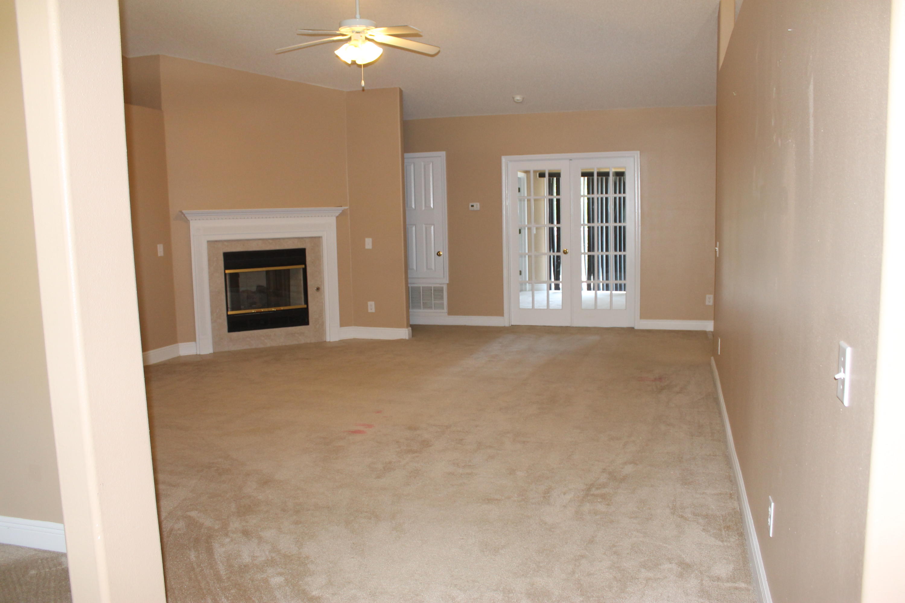 213 Foxchase Way Crestview, FL 32536 - Photo 4 of 34 a view of an empty room with a fireplace