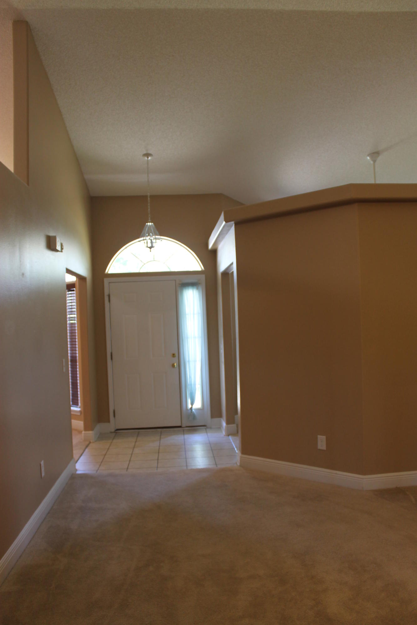 213 Foxchase Way Crestview, FL 32536 - Photo 5 of 34 wooden floor in an empty room with a window