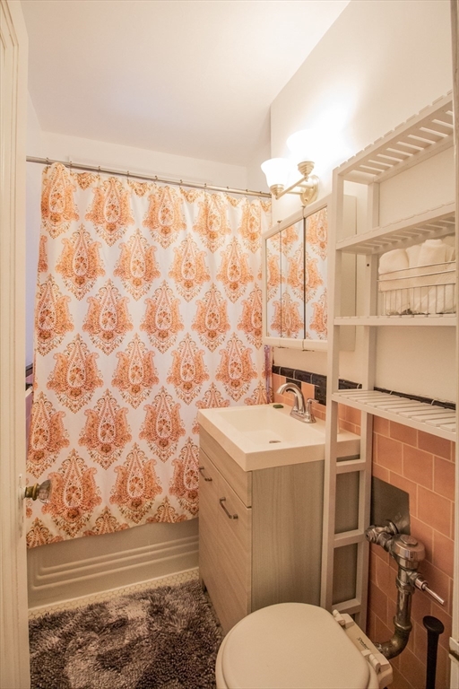 90 Kilsyth Road, Unit 37 Boston, MA 02135 - Photo 5 of 5 a bathroom with a sink toilet and shower