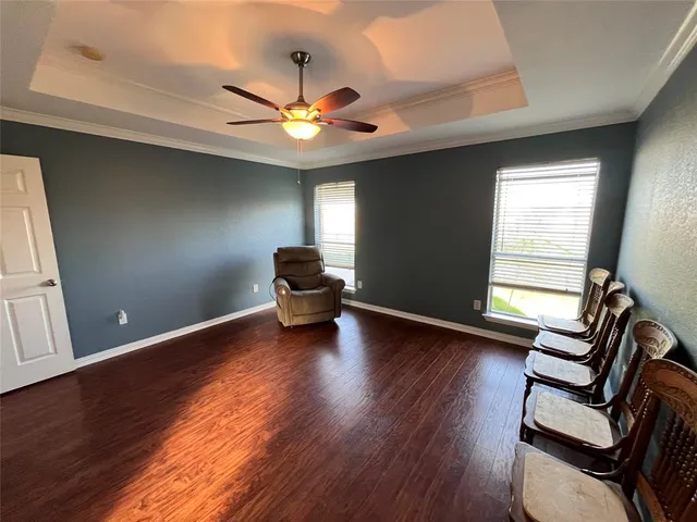 a view of a kitchen with a stove wooden floor a sink and dishwasher