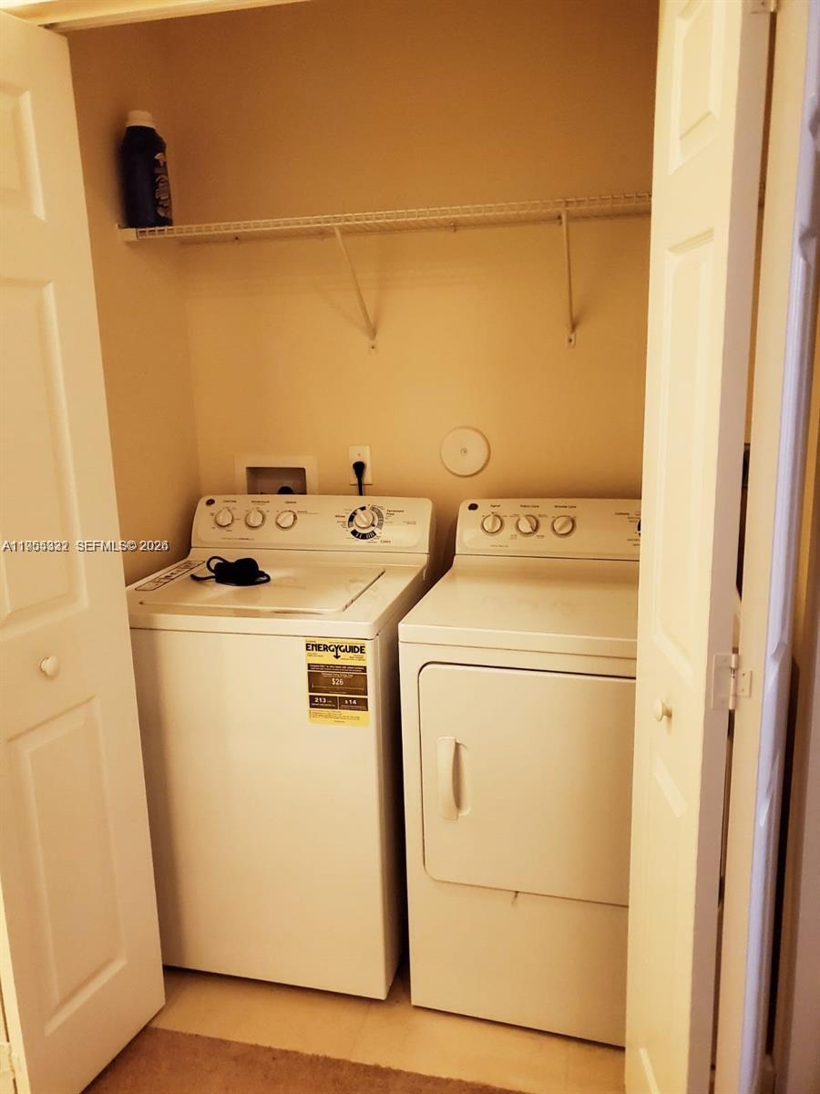 3353 West 91st Terrace Hialeah, FL 33018 - Photo 11 of 21 a utility room with dryer and washer