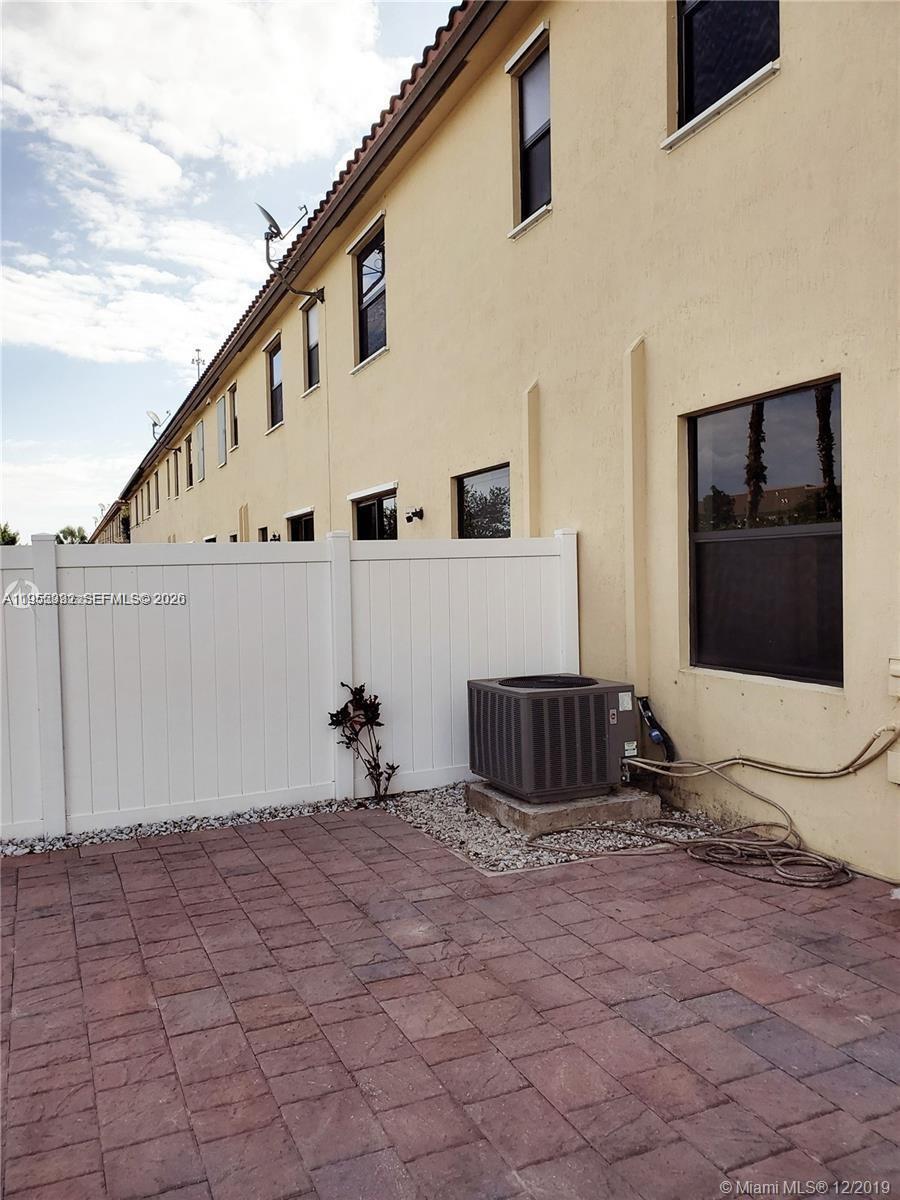 3353 West 91st Terrace Hialeah, FL 33018 - Photo 16 of 21 a view of a house with backyard and sitting area