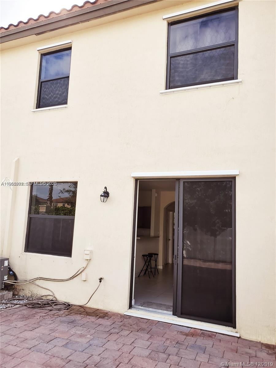 3353 West 91st Terrace Hialeah, FL 33018 - Photo 17 of 21 a bathroom with a sink and a mirror