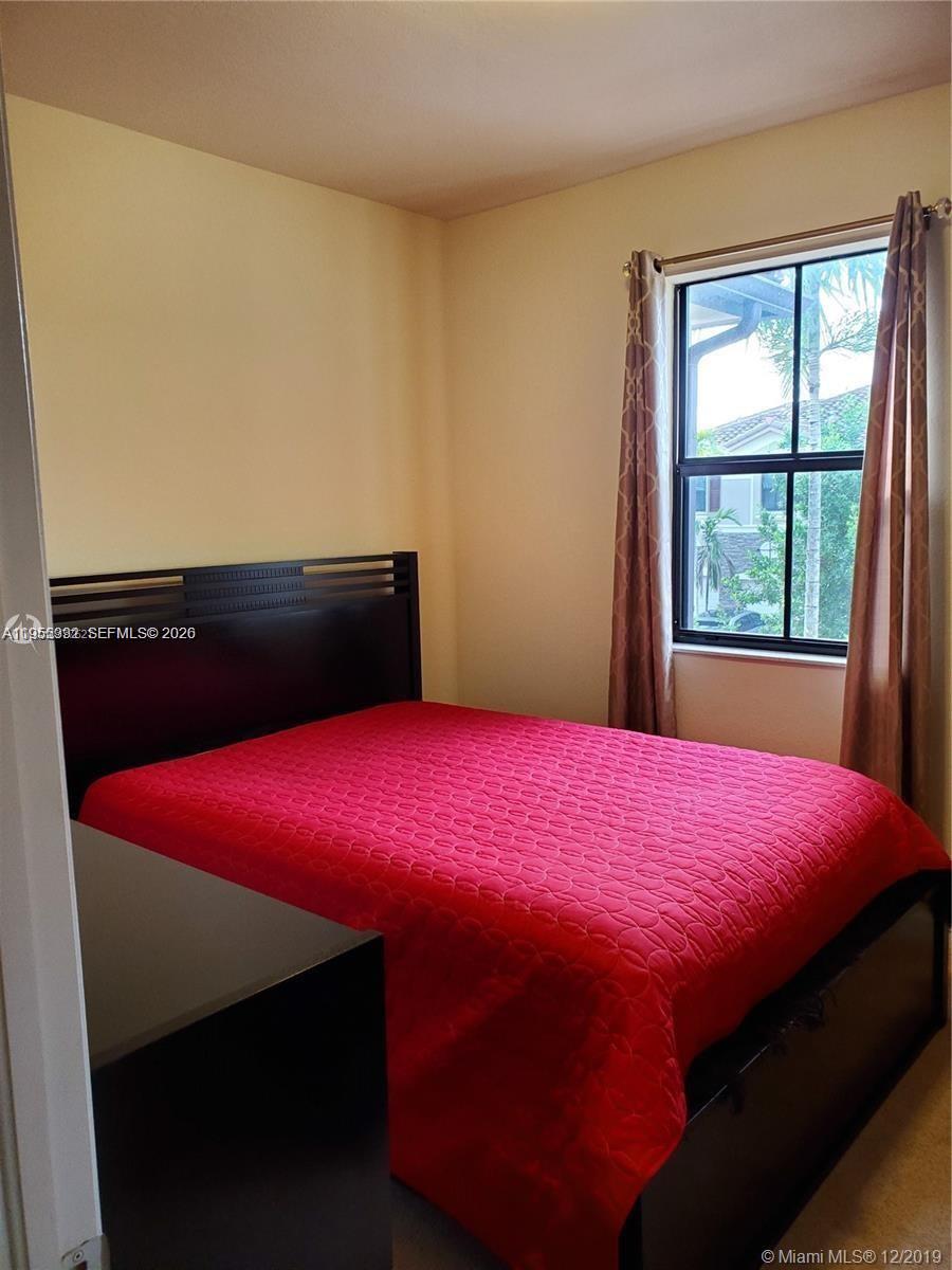 3353 West 91st Terrace Hialeah, FL 33018 - Photo 5 of 21 a bedroom with a bed and a window