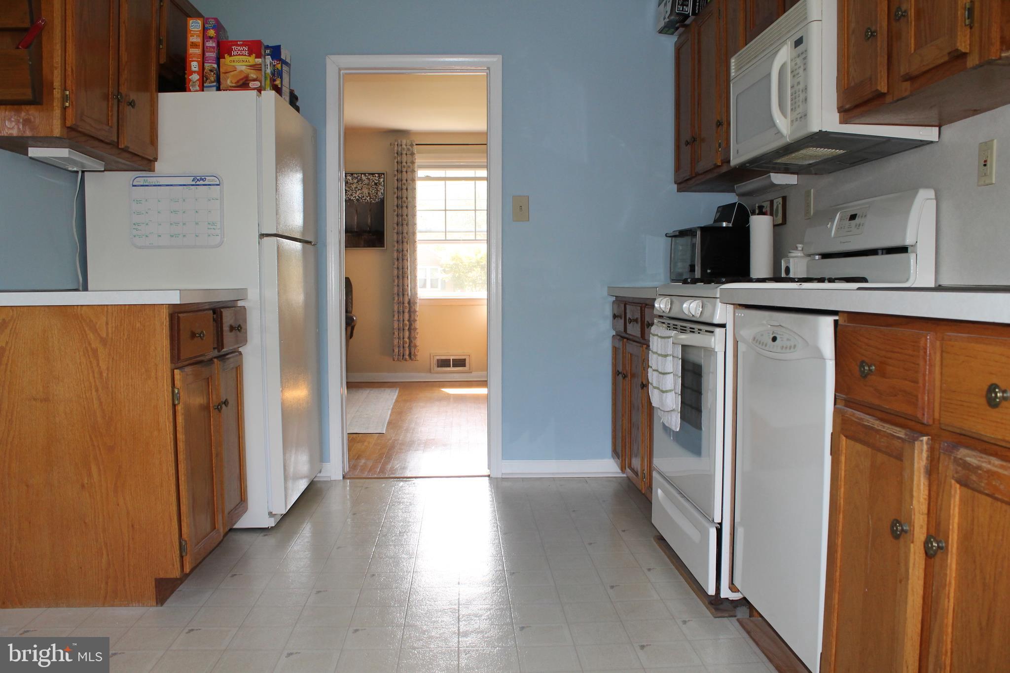 35 Overhill Road Stratford, NJ 08084 - Photo 14 of 43 a view of a kitchen with a refrigerator a stove top oven a sink and dishwasher