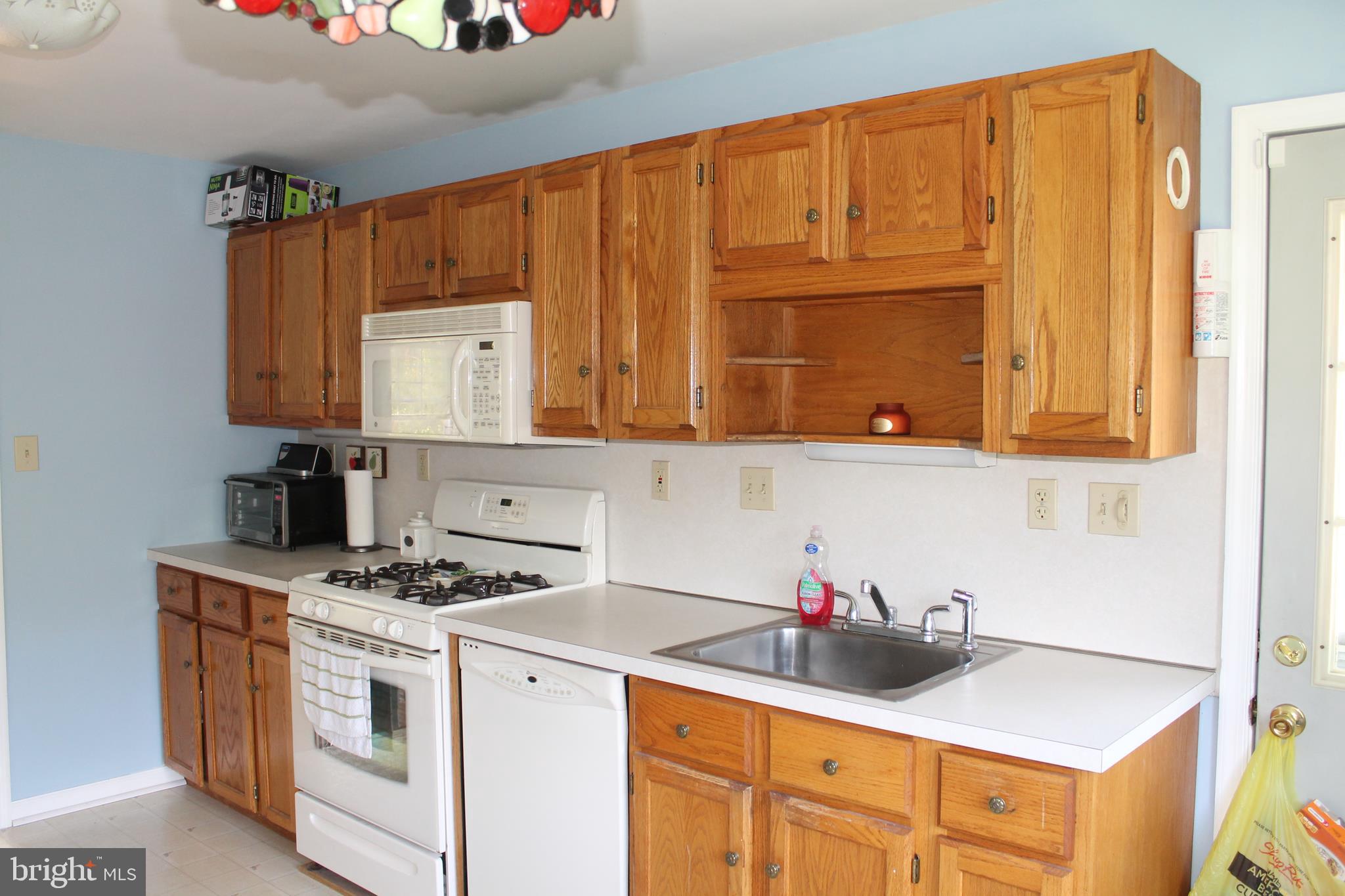 35 Overhill Road Stratford, NJ 08084 - Photo 15 of 43 a kitchen with stainless steel appliances granite countertop a sink stove and cabinets