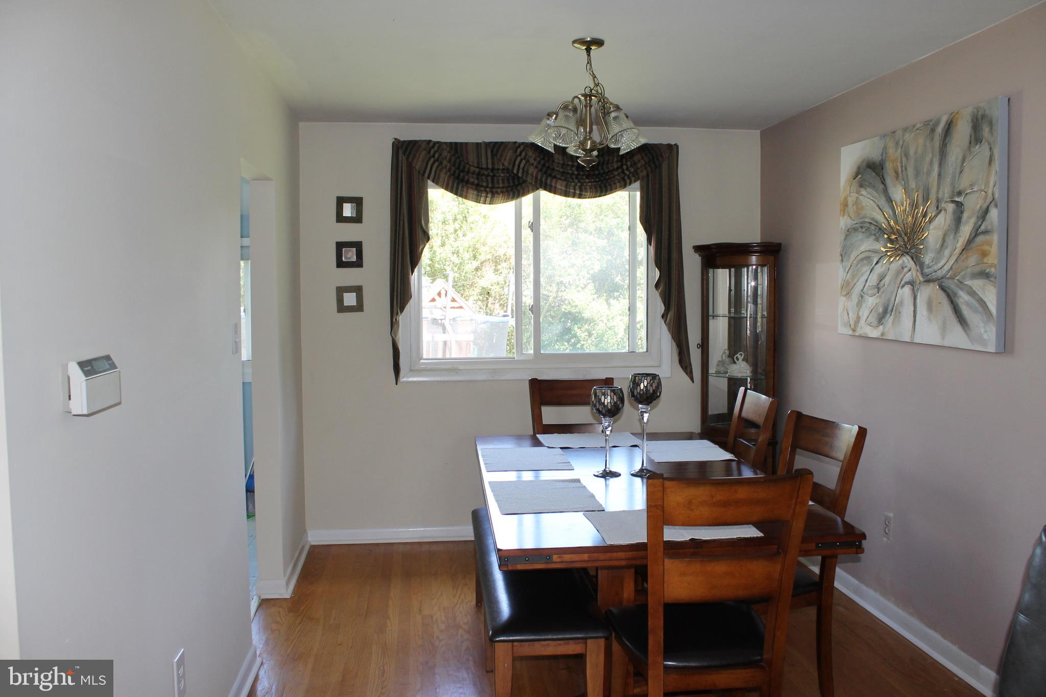35 Overhill Road Stratford, NJ 08084 - Photo 16 of 43 a view of a dining room with furniture window and wooden floor