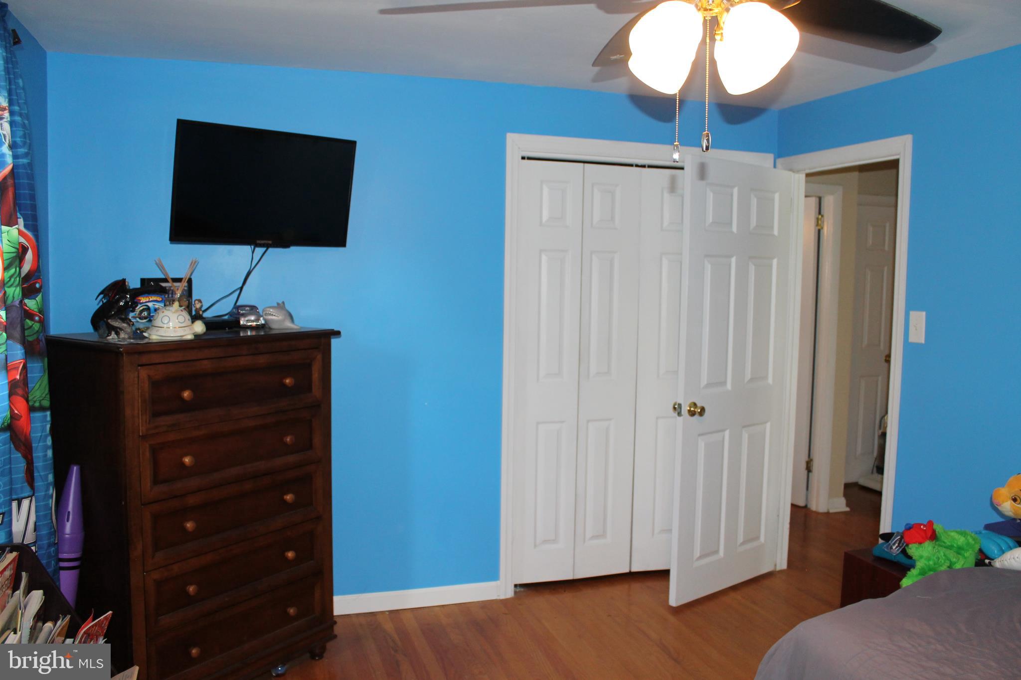 35 Overhill Road Stratford, NJ 08084 - Photo 23 of 43 a living room with furniture and a flat screen tv