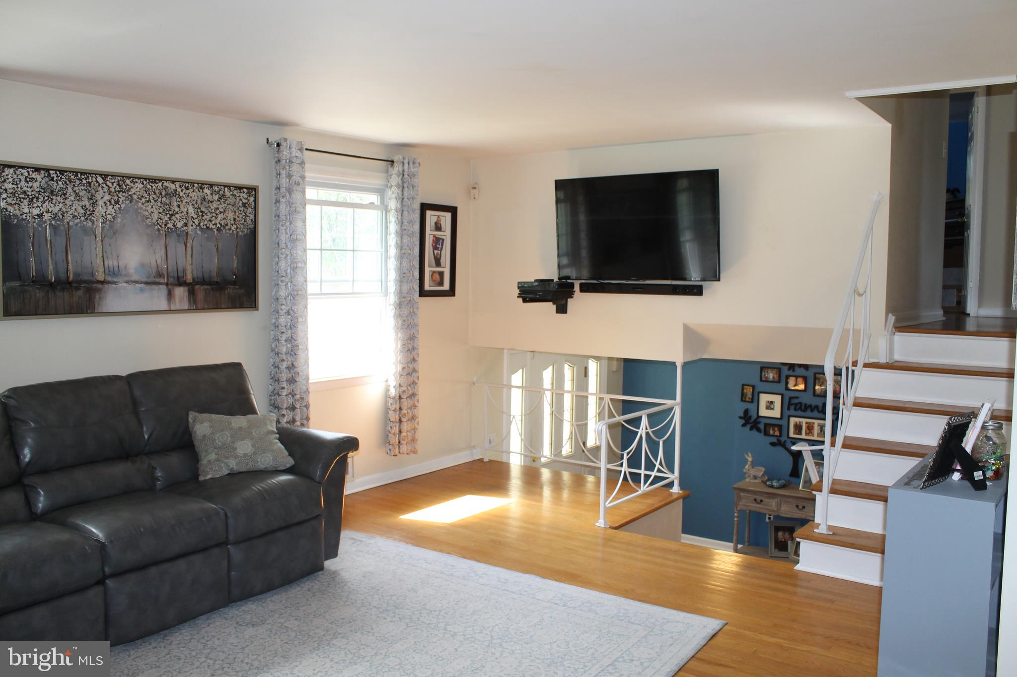 35 Overhill Road Stratford, NJ 08084 - Photo 9 of 43 a living room with furniture and a flat screen tv