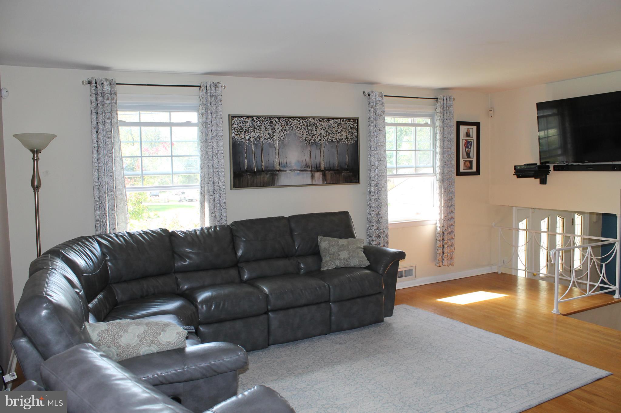 35 Overhill Road Stratford, NJ 08084 - Photo 10 of 43 a living room with furniture and a flat screen tv
