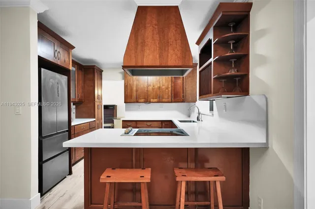 a kitchen with stainless steel appliances a stove and a refrigerator