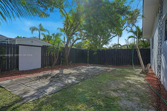 a view of backyard with tree