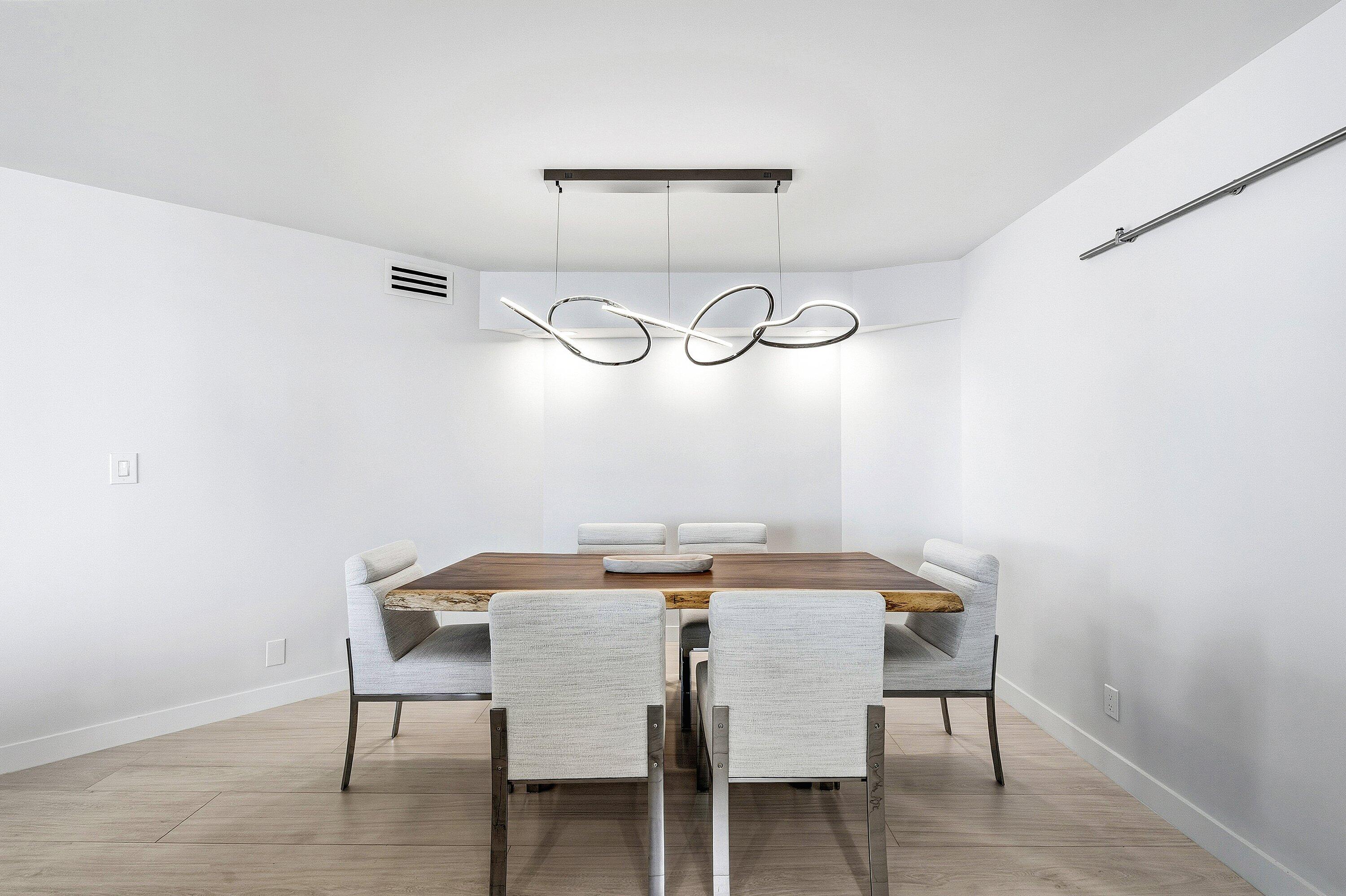 500 South Ocean Boulevard, Unit 801 Boca Raton, FL 33432 - Photo 11 of 61 a view of a dining room that has a table and chairs