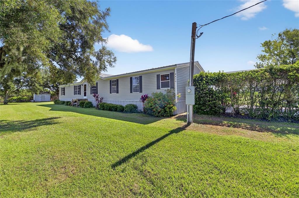 4416 Pippin Road Plant City, FL 33567 - Photo 3 of 86 a view of a house with a big yard