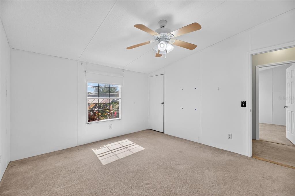 4416 Pippin Road Plant City, FL 33567 - Photo 43 of 86 an empty room with windows and fan