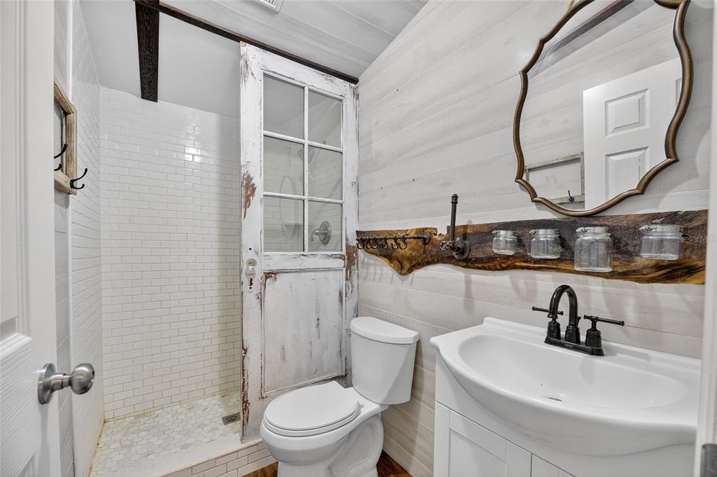 4416 Pippin Road Plant City, FL 33567 - Photo 47 of 86 a bathroom with a sink a toilet and a mirror