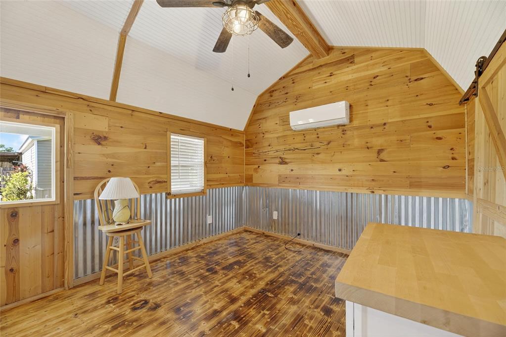 4416 Pippin Road Plant City, FL 33567 - Photo 53 of 86 a bedroom with a bed and wooden floor