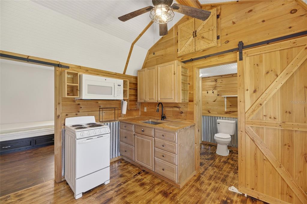 4416 Pippin Road Plant City, FL 33567 - Photo 54 of 86 a bathroom with a granite countertop sink toilet and shower