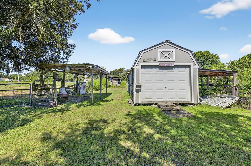 4416 Pippin Road Plant City, FL 33567 - Photo 63 of 86 a view of a house with a yard