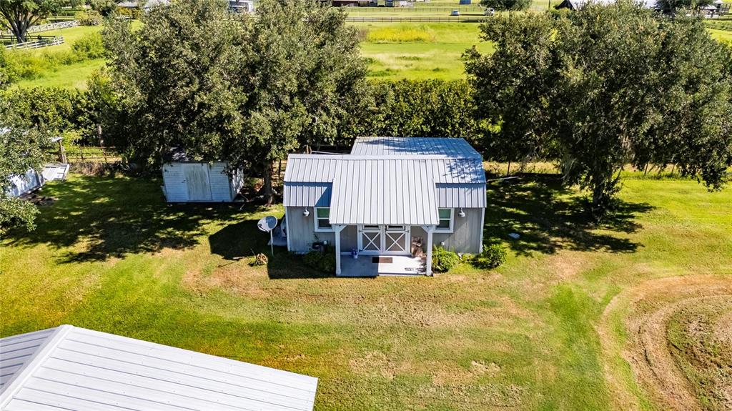 4416 Pippin Road Plant City, FL 33567 - Photo 74 of 86 a view of a house with a yard and sitting area