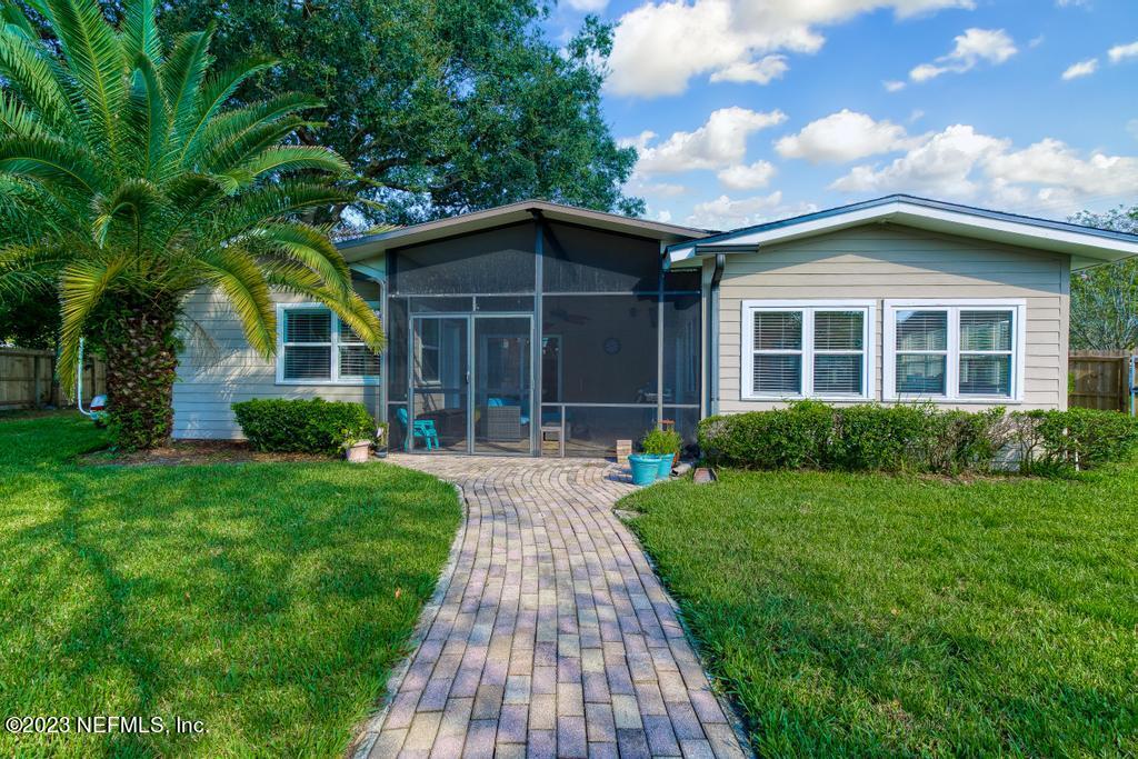14340 Stacey Road Jacksonville, FL 32250 - Photo 36 of 54 a front view of a house with a yard