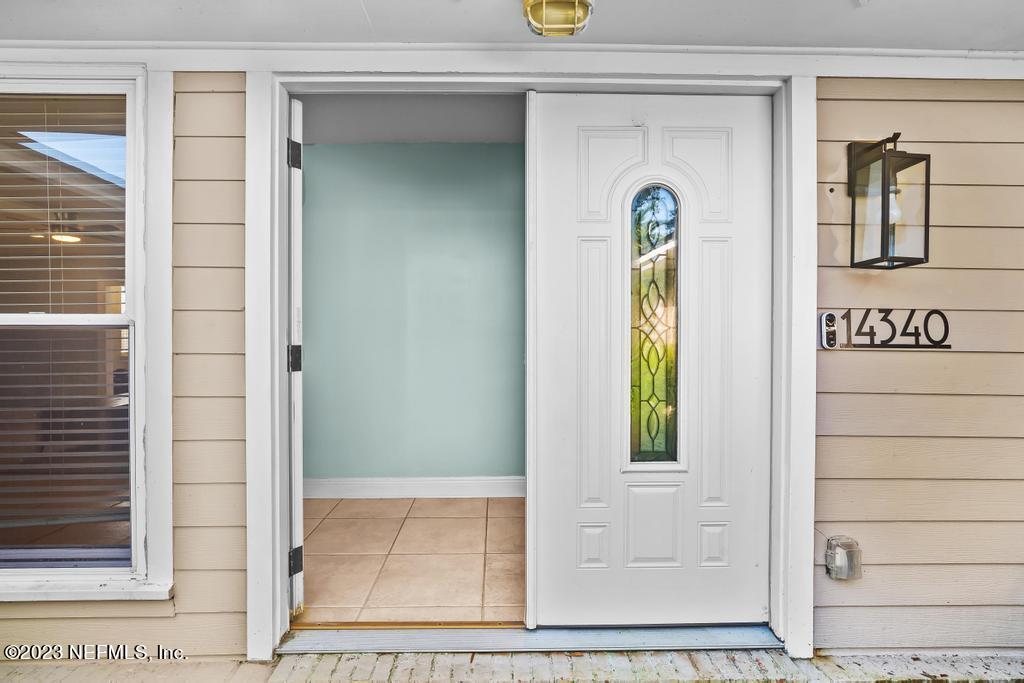 14340 Stacey Road Jacksonville, FL 32250 - Photo 6 of 54 a view of front door