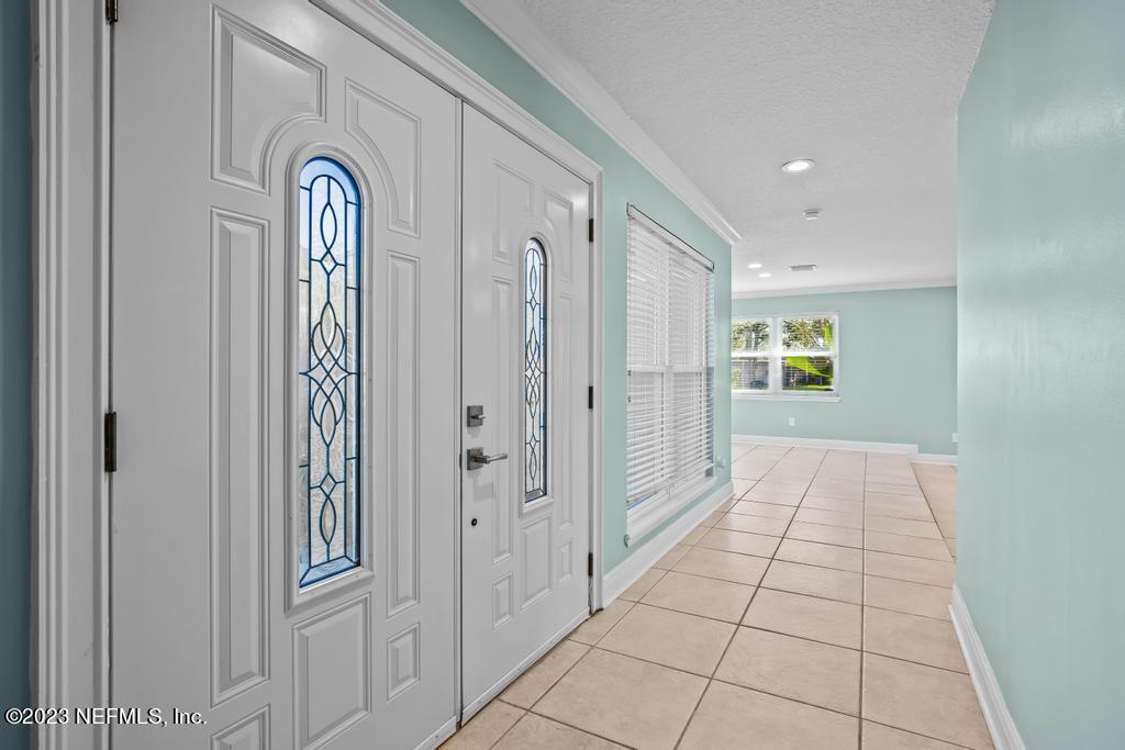 14340 Stacey Road Jacksonville, FL 32250 - Photo 8 of 54 a view of a hallway with front door