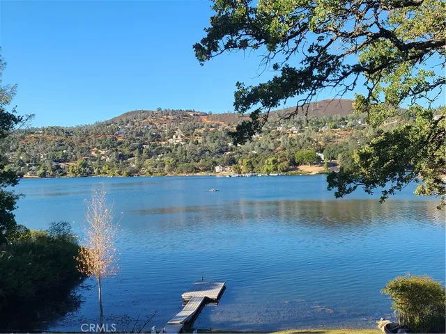 an aerial view of a house with a lake view