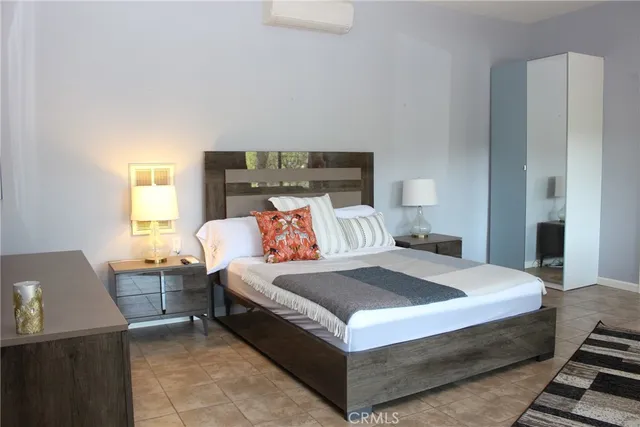 a bedroom with a bed and window