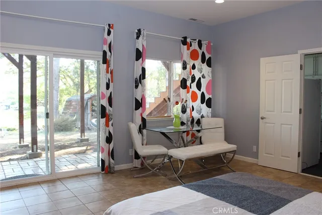 a living room with furniture and a rug