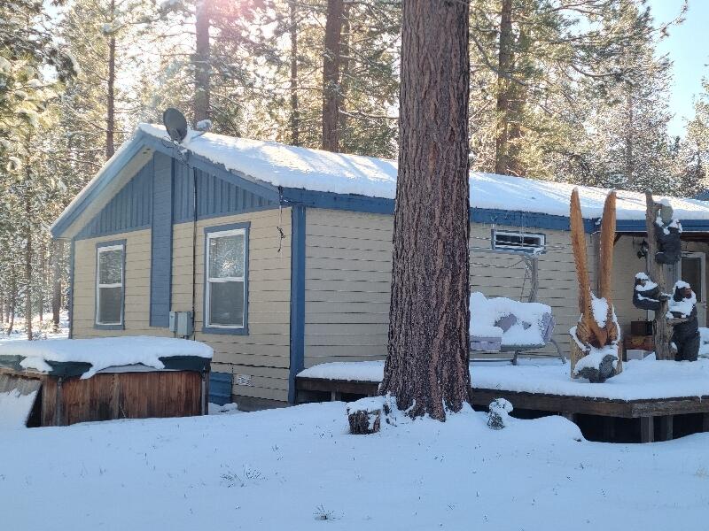 1831 Terret Road La Pine, OR 97739 - Photo 7 of 49 Backside of home showing the large deck. NOTE: hottub will be removed, it is nonfuntioning.