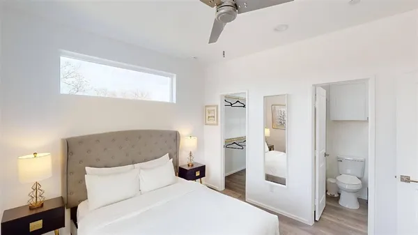 a bedroom with a bed and a view of bathroom