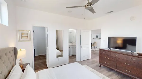 a view of a livingroom with furniture and a flat screen tv