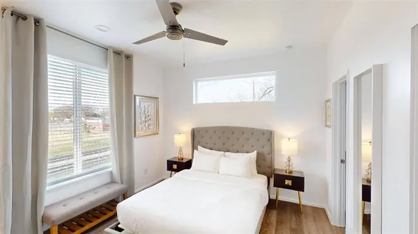 a bedroom with a bed and a table